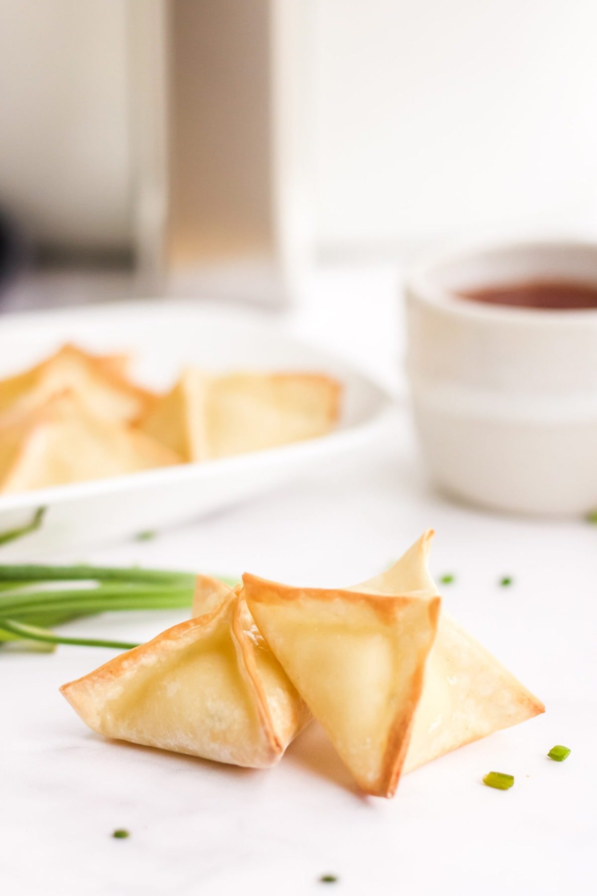 air fryer wontons with cream cheese filling, air fryer, dipping sauce.