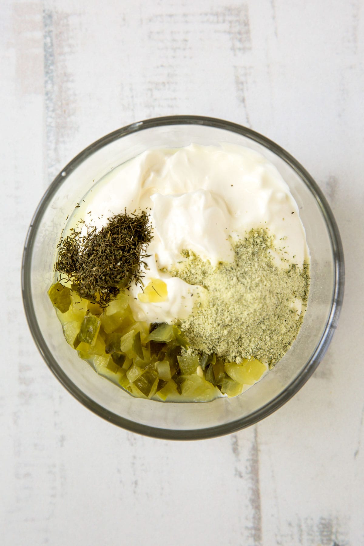 pickles, greek yogurt, dill in a bowl