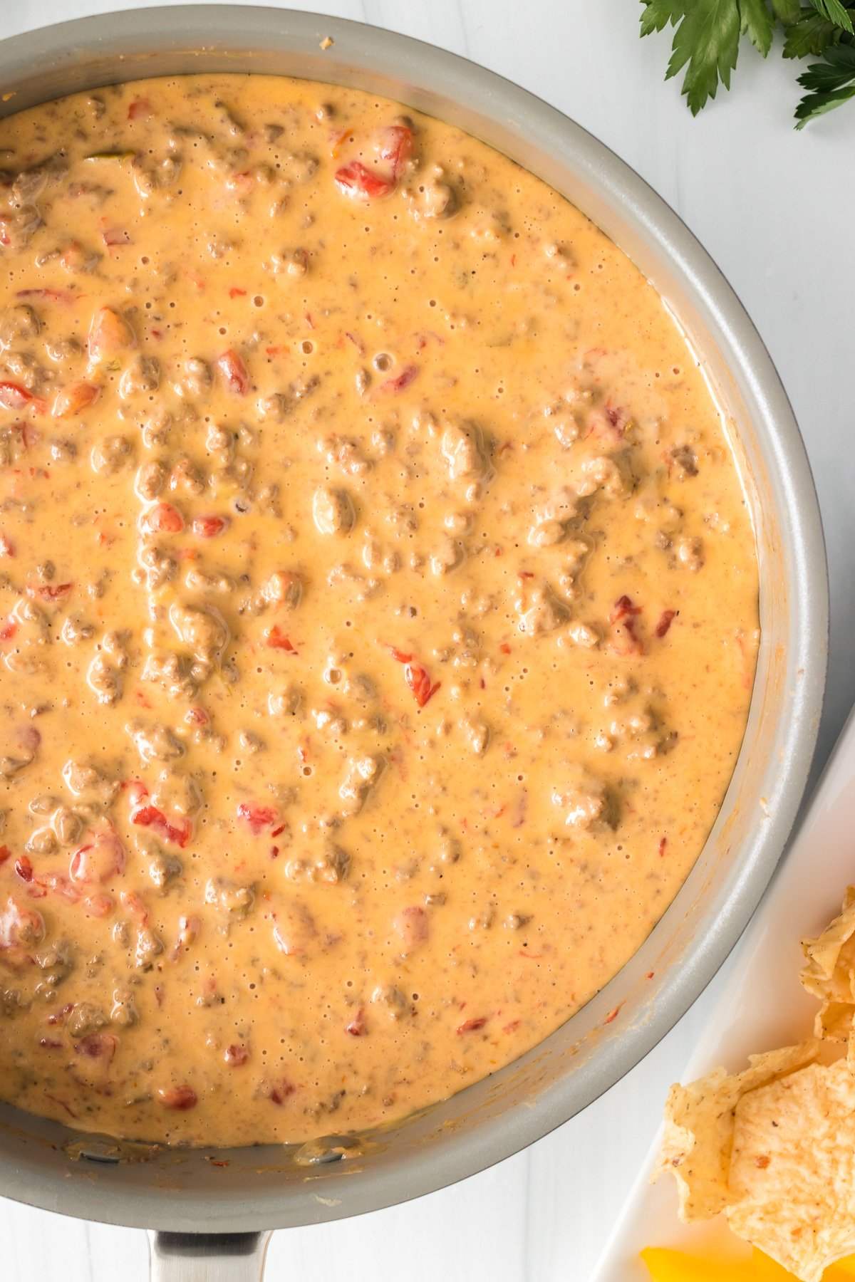 close up of cheesy rotel dip in a skillet