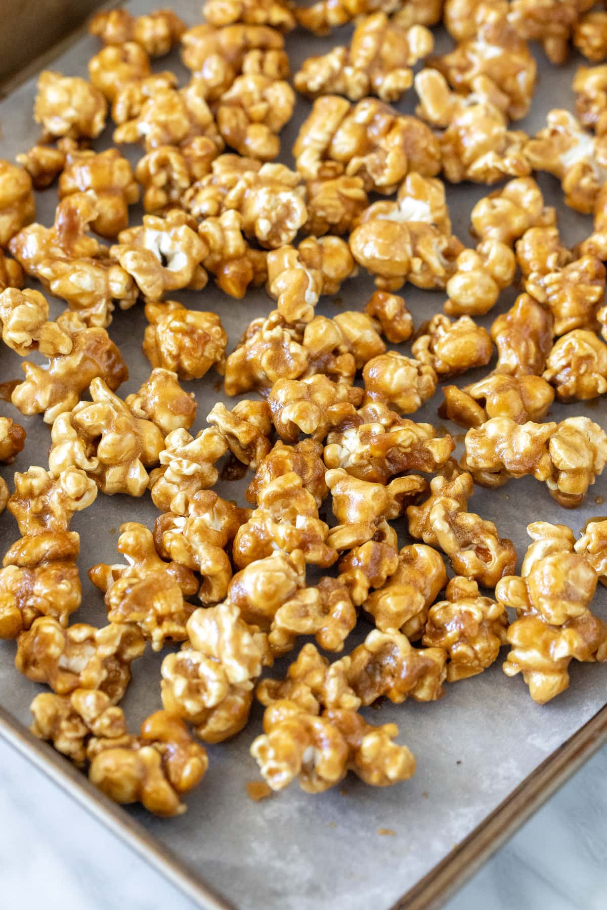 Caramel popcorn on a baking sheet