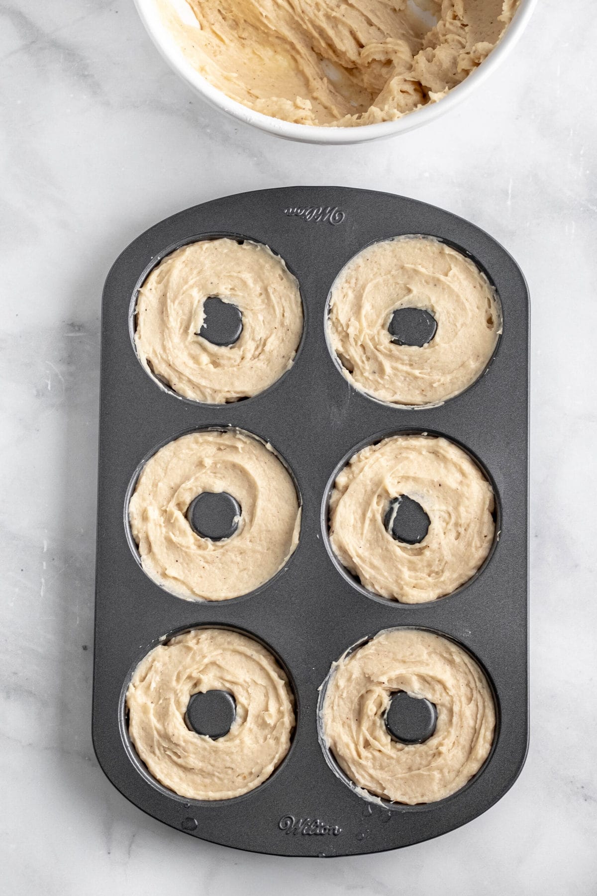 donut pan filled with donut batter