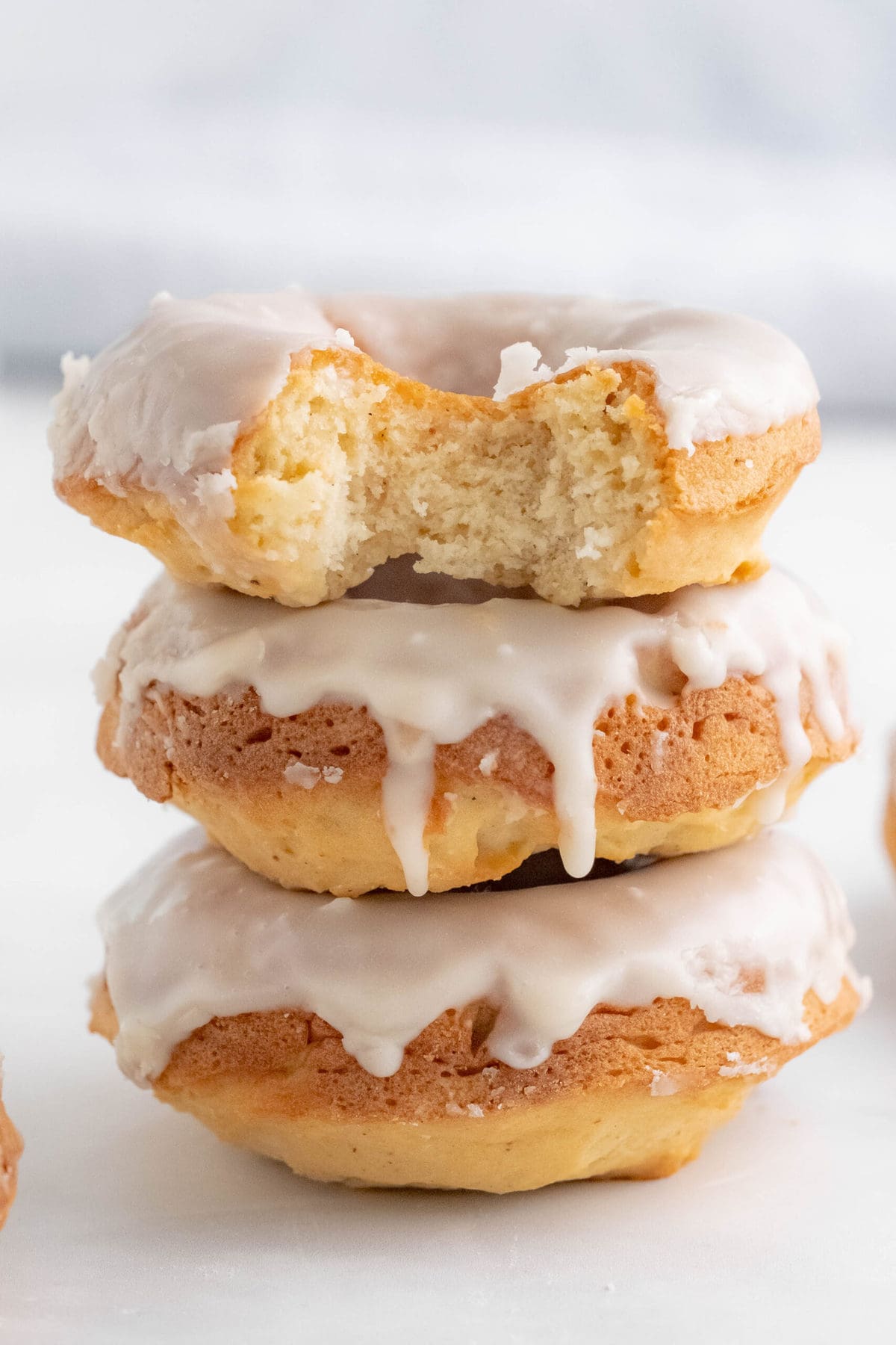 stack of donuts with a bite taken out of one