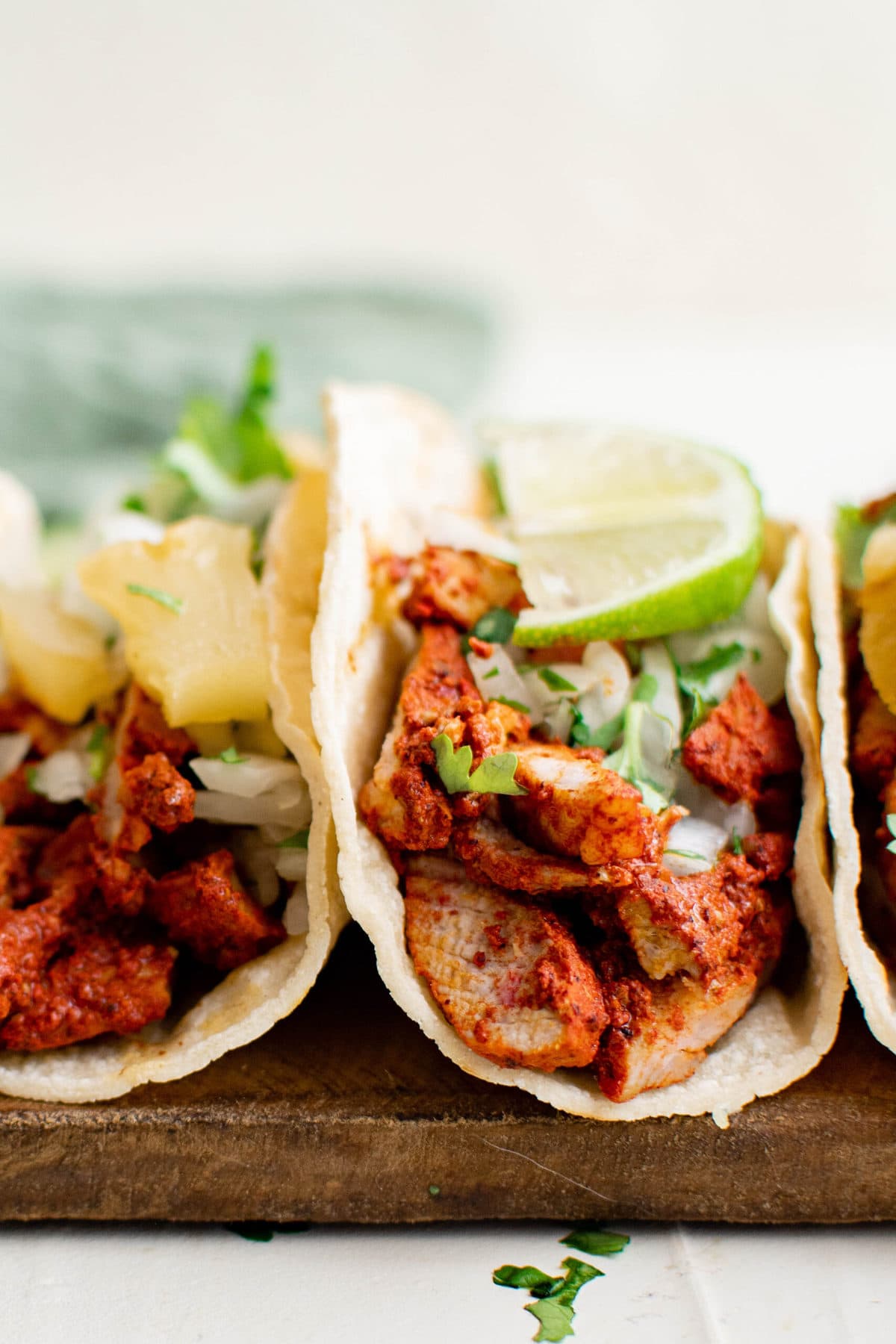 tacos al pastor with pineapple and lime