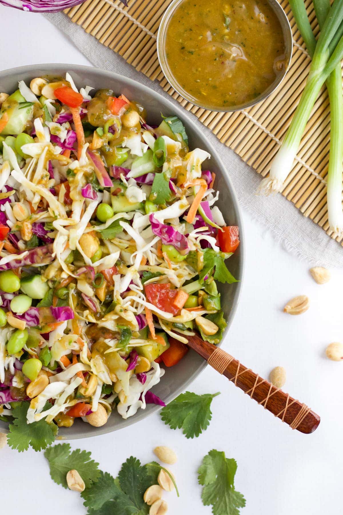 An overhead image of a Thai salad recipe with dressing.