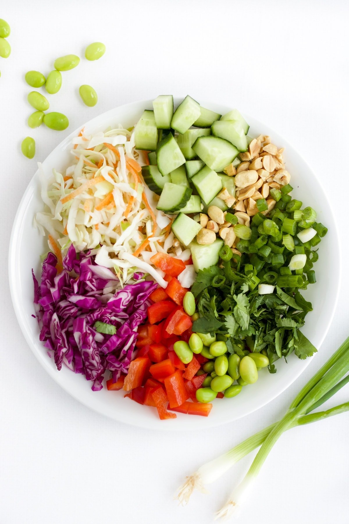 Ingredients for Thai Salad in a white bowl.