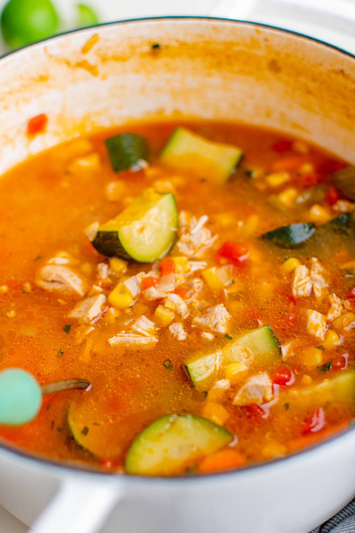 white soup post with caldo de pollo mexican chicken soup, chicken, corn, zucchini