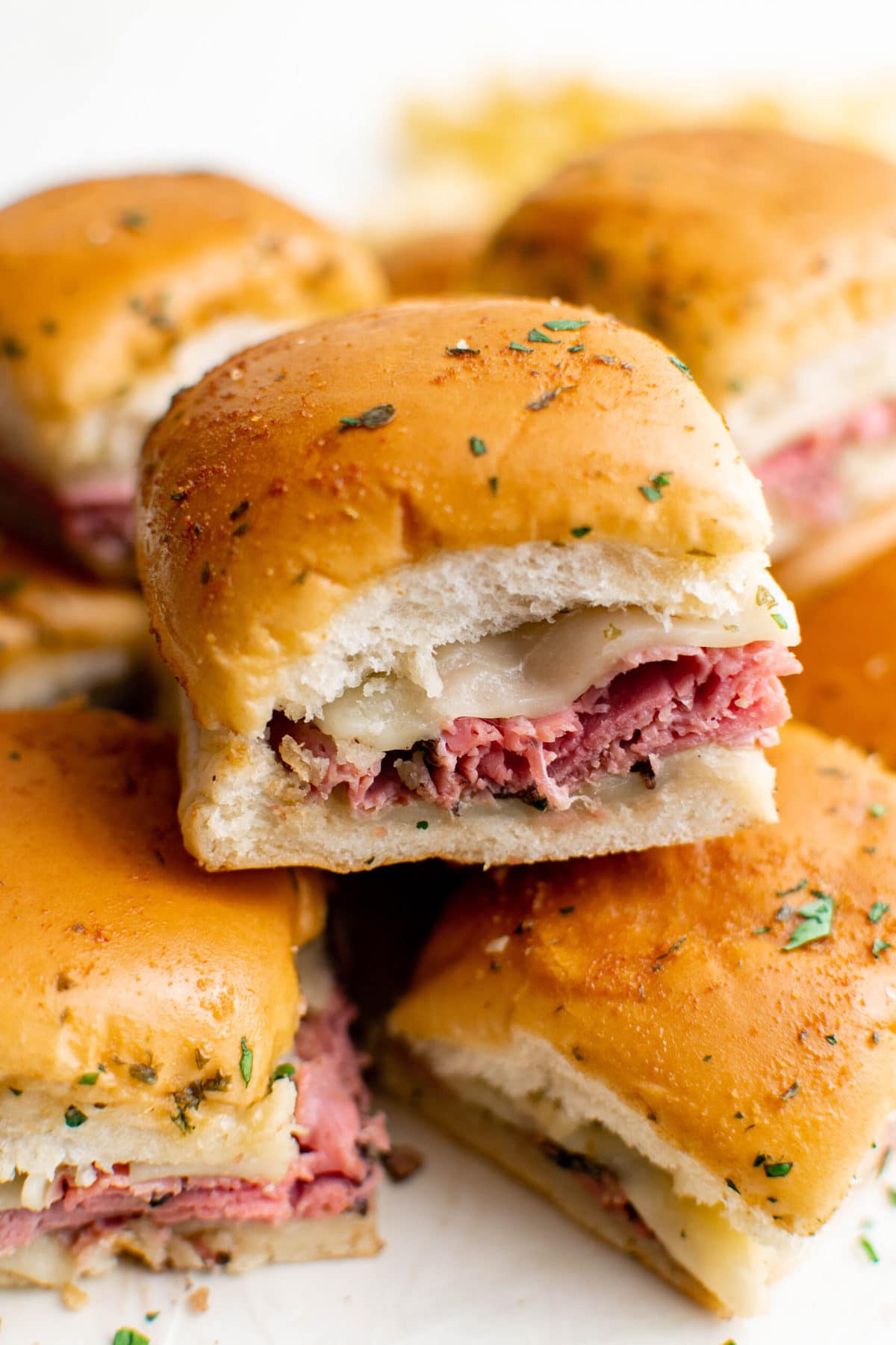 stack of slider rolls with roast beef and cheese