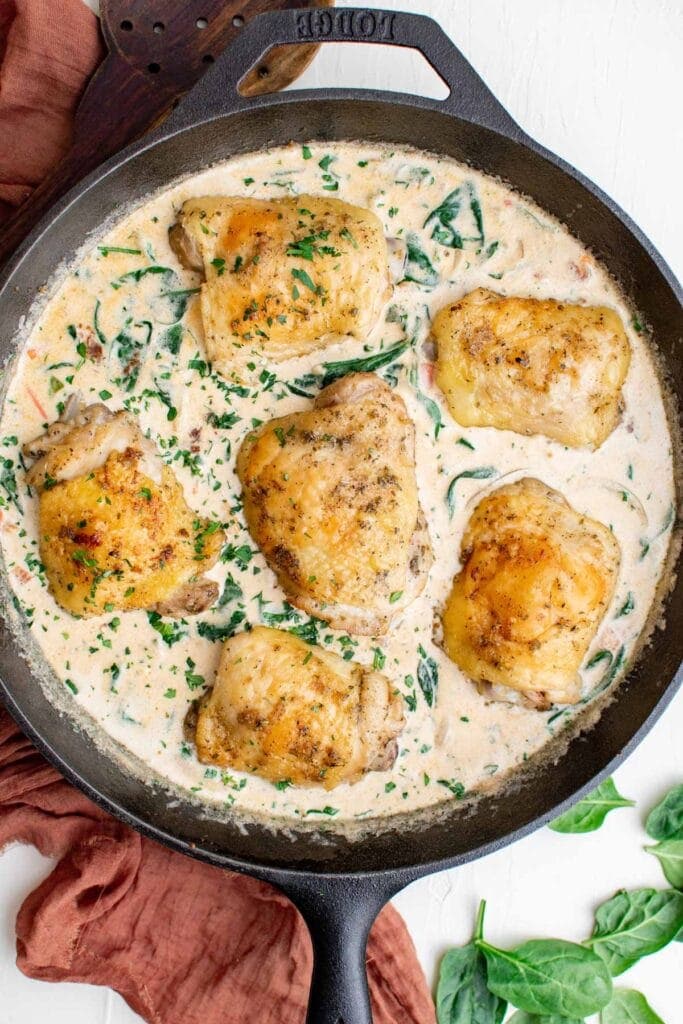 Creamy Tuscan chicken in cast iron pan