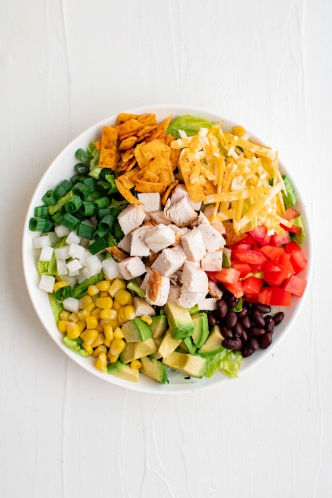 ingredients for bbq chicken salad in a bowl