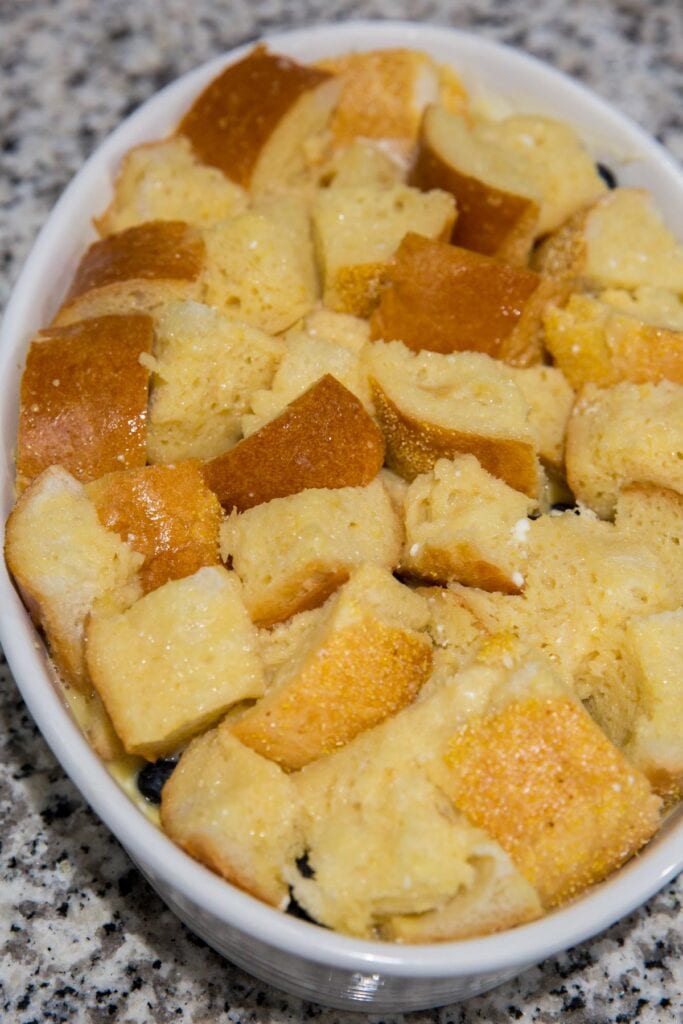 french bread cubes in a baking dish