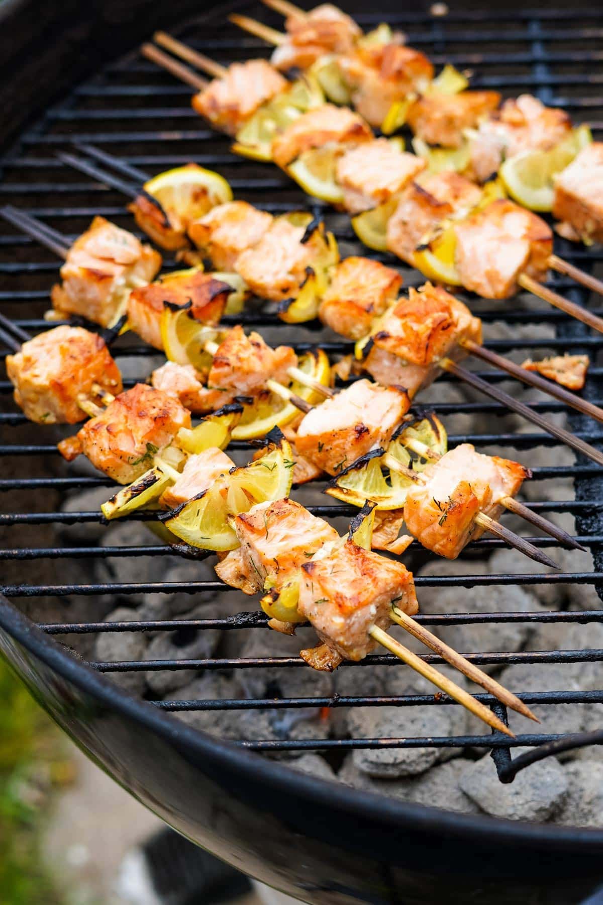 salmon kabobs with lemon on a grill