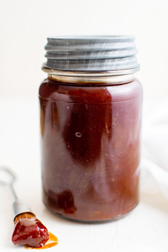 jar with silver lid holding bbq sauce