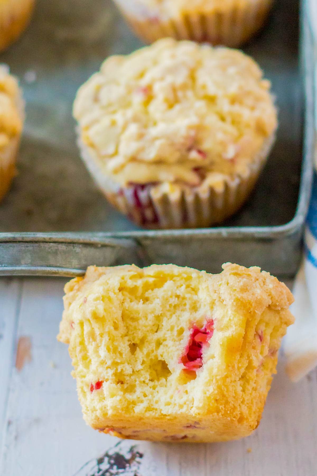 rasberry muffins with a bite taken out