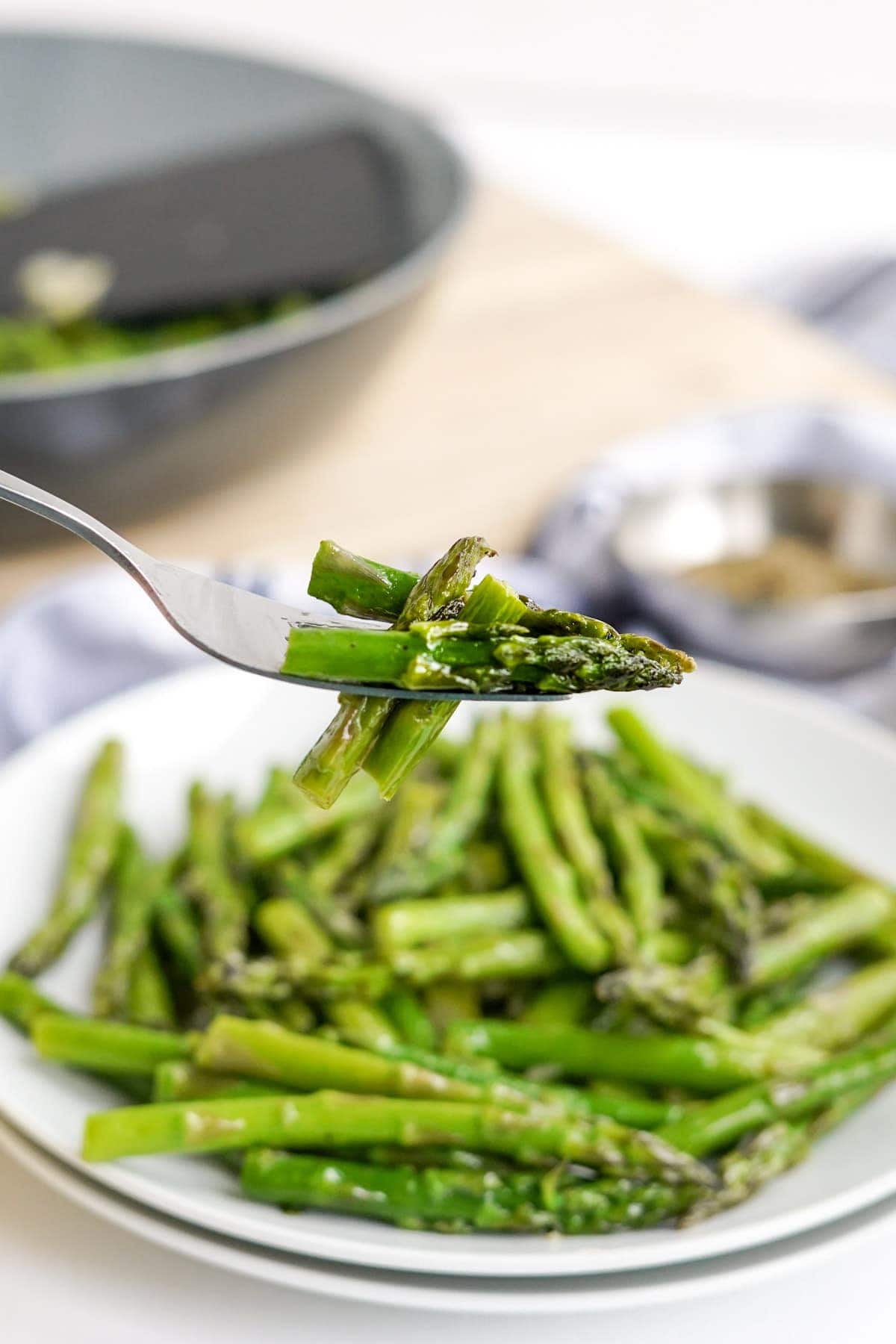 plate of asparagus, fork