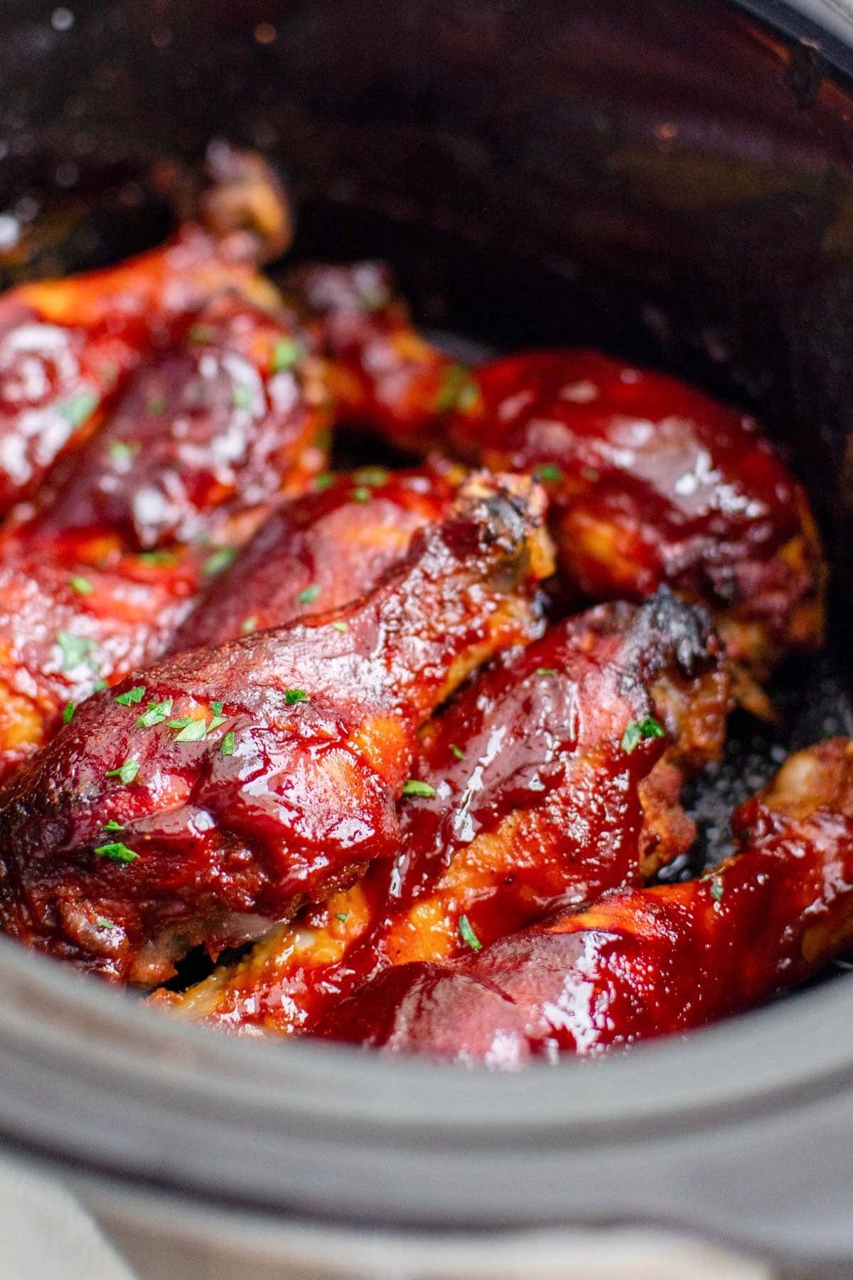 slow cooker with bbq sauced chicken legs