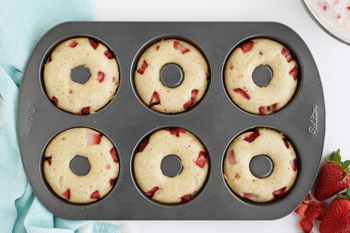 strawberry doughnuts in a donut pan.