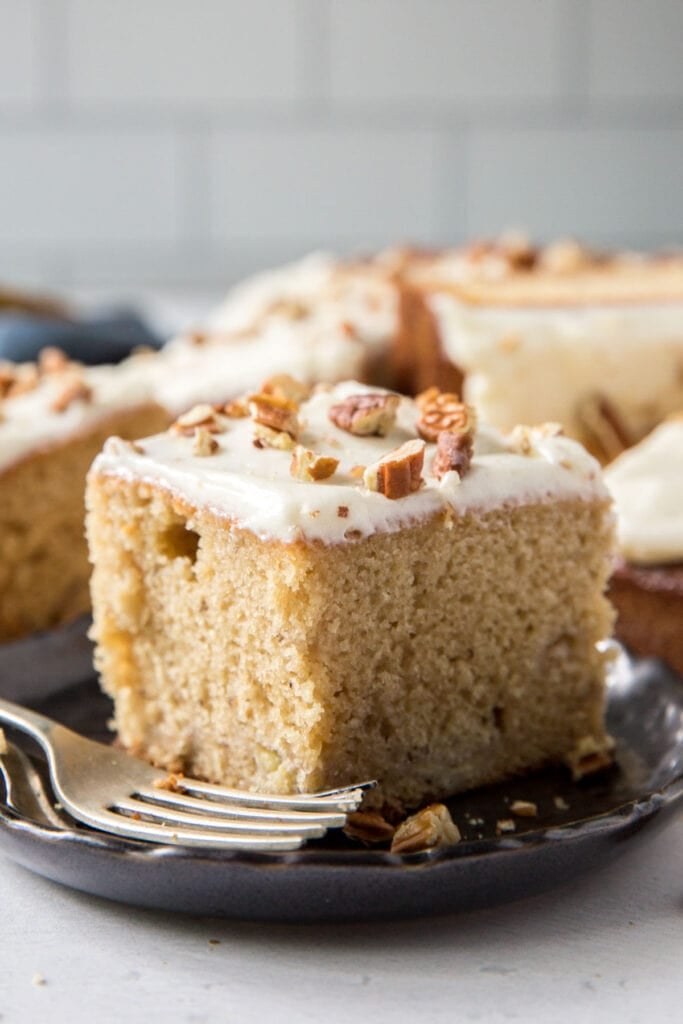 slice of cake on a plate with a fork