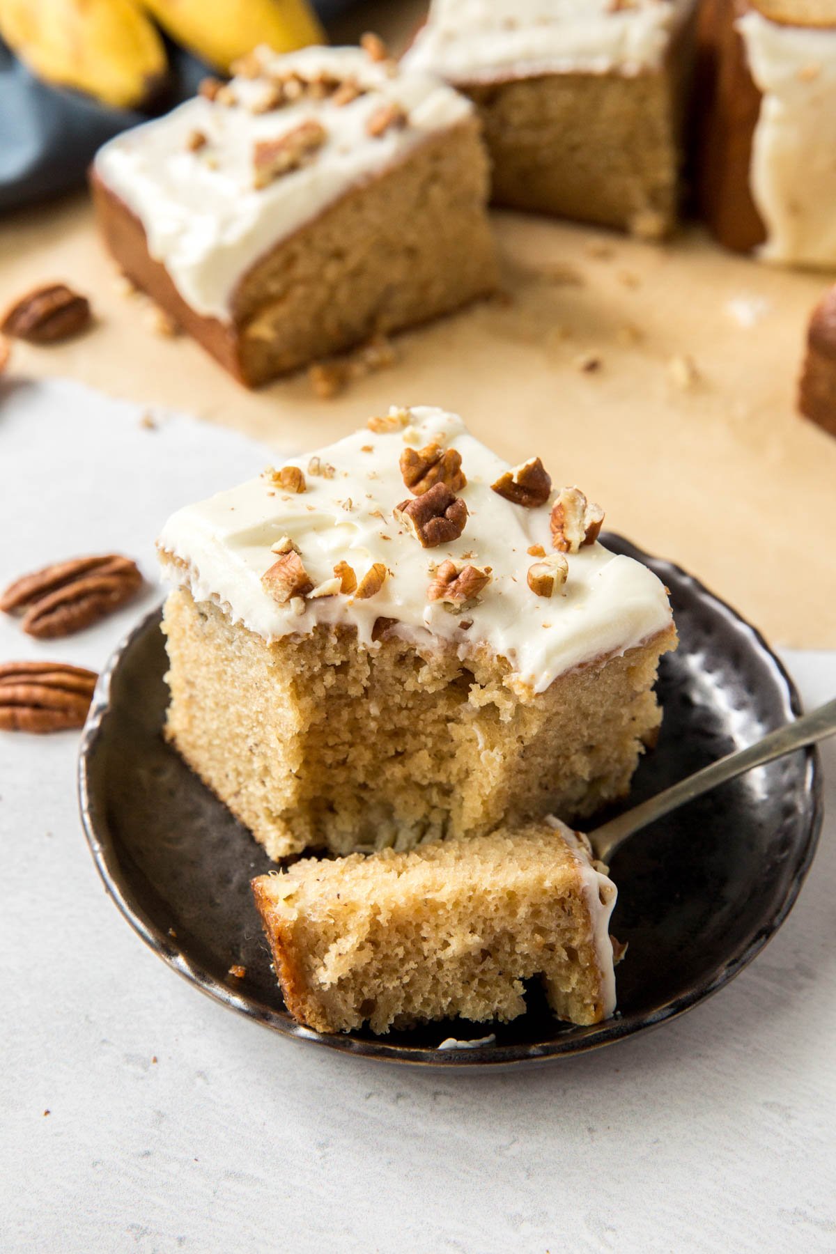 slice of banana cake, chunk of banana cake on a fork