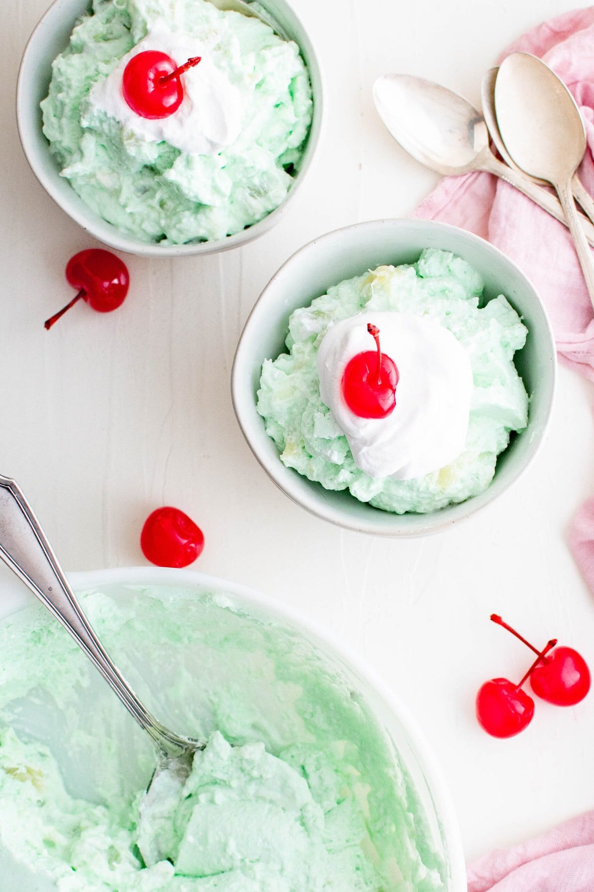 dishes with jello salas, whipped cream and cherries