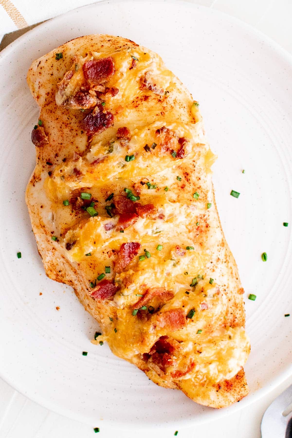 close up of a piece of hasselback chicken