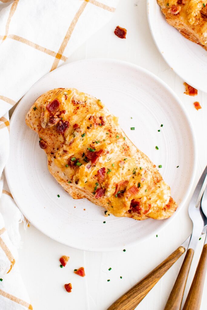 baked chicken hasselback style with cheese and bacon