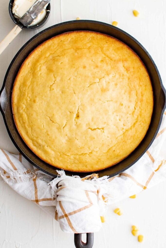 baked batch of cornbread in a cast iron skillet 
