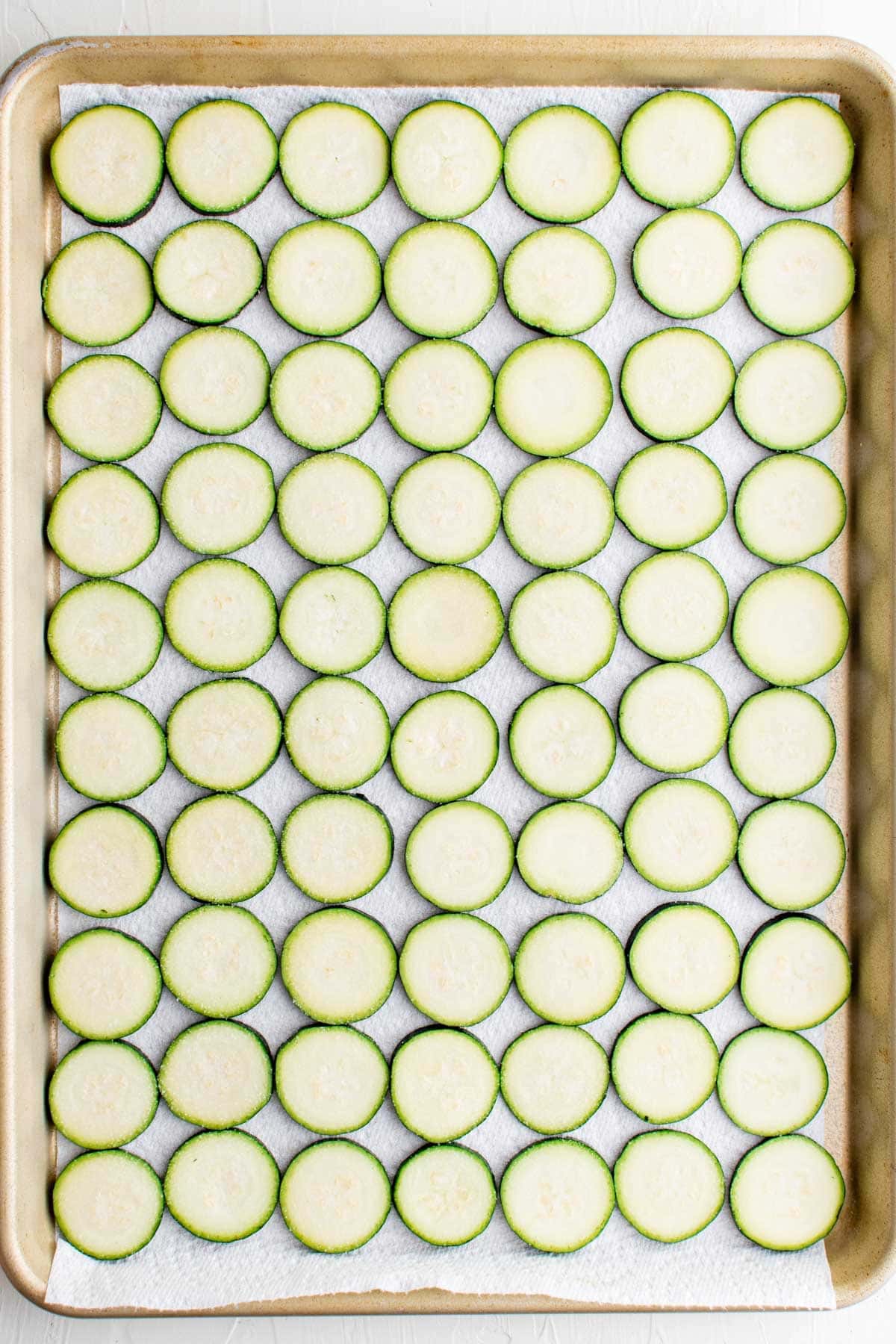 slices of zucchini on a baking sheet