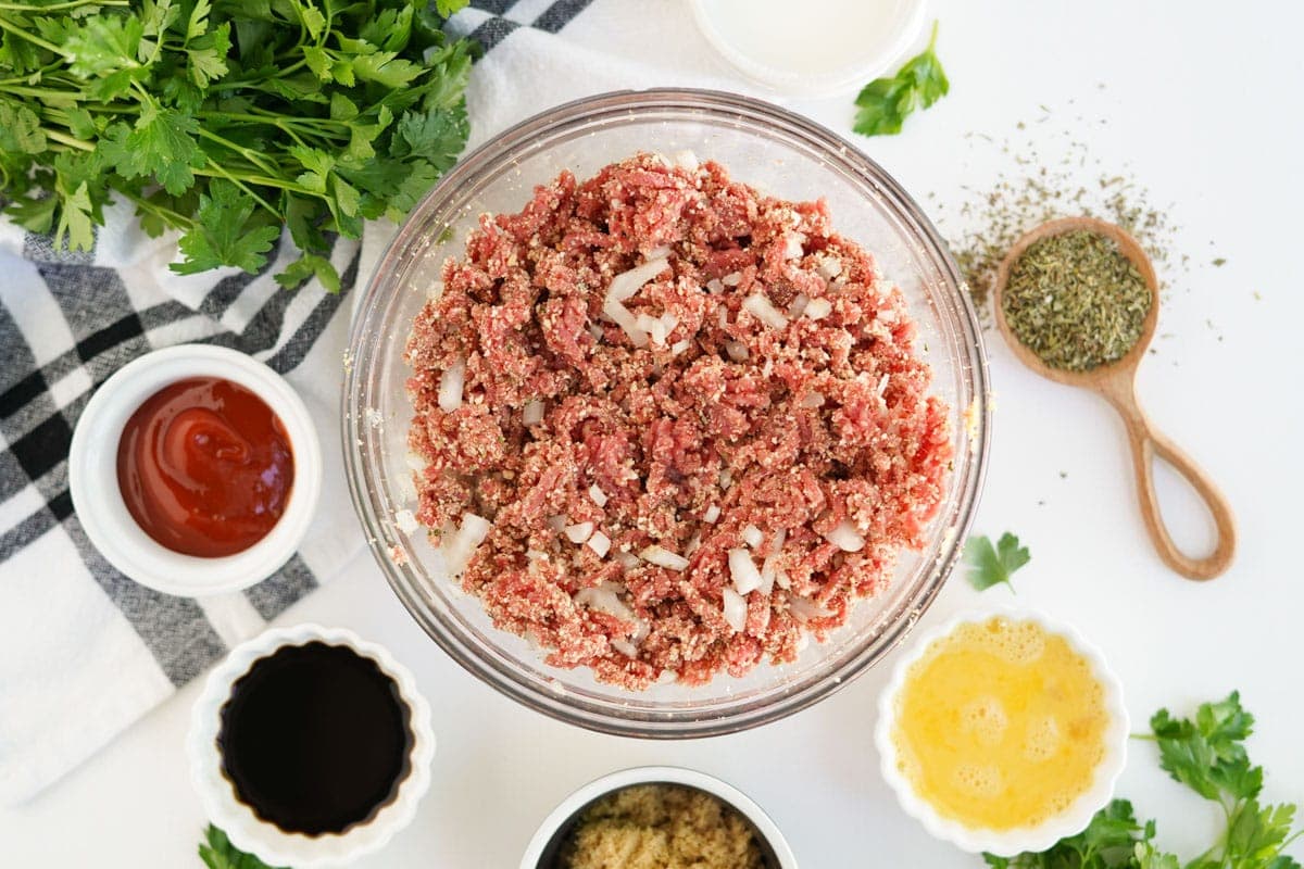 bowl of meatloaf mixture, plus ingredients