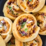 Rolled up crescent rolls with chicken, bbq sauce and onions.