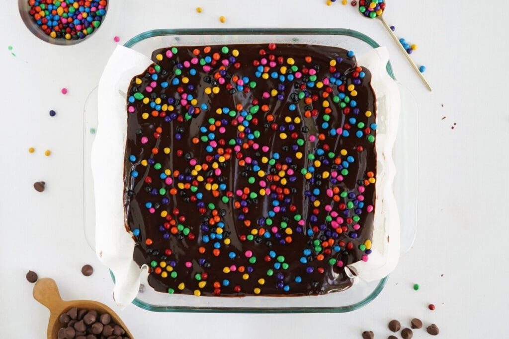 cosmic brownies with sprinkles in a glass baking dish