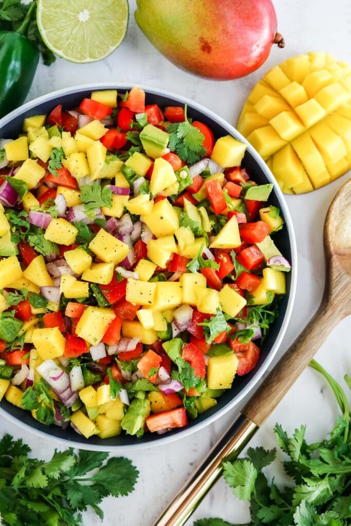 mango salsa in a blue and white bowl