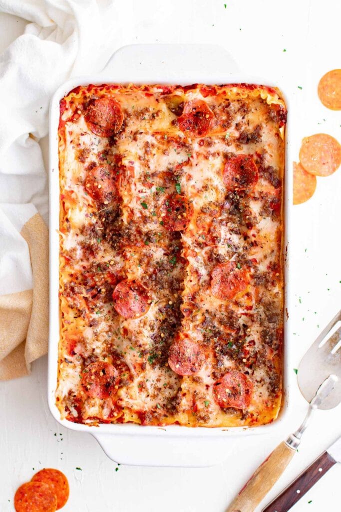 baking dish with lasagna with pepperoni