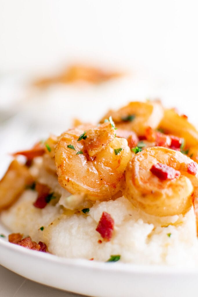 southern style shrimp and grits on a white plate