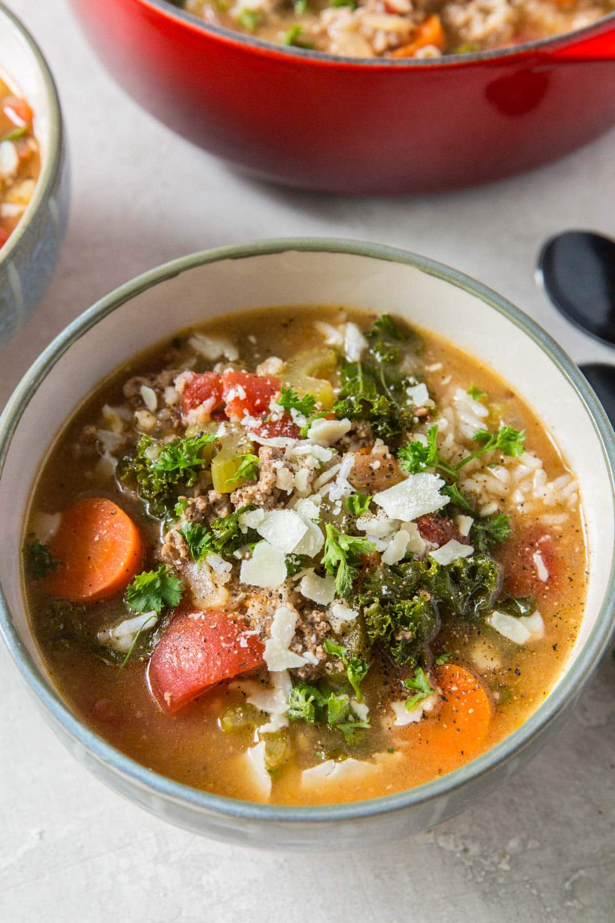 bowl of ground turkey soup with parmesan cheese