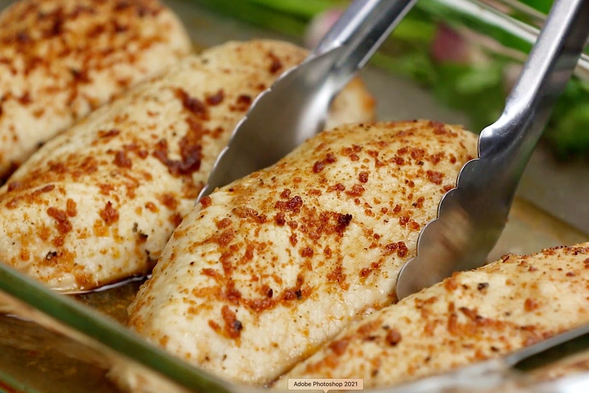 baked chicken breasts and tongs