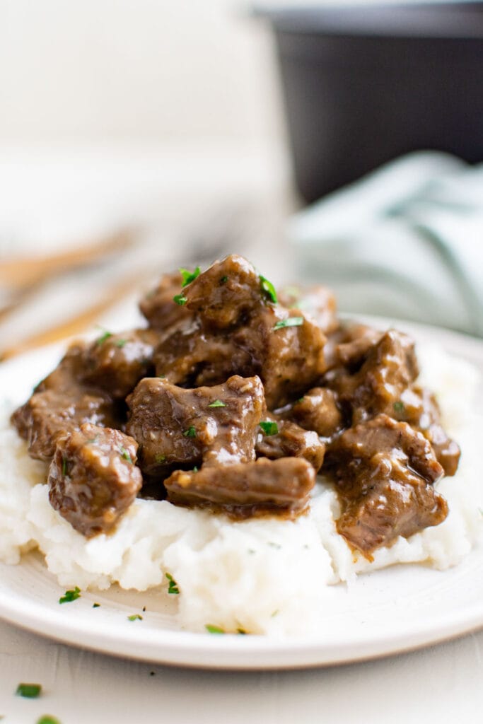 beef tips with gravy over mashed potatoes