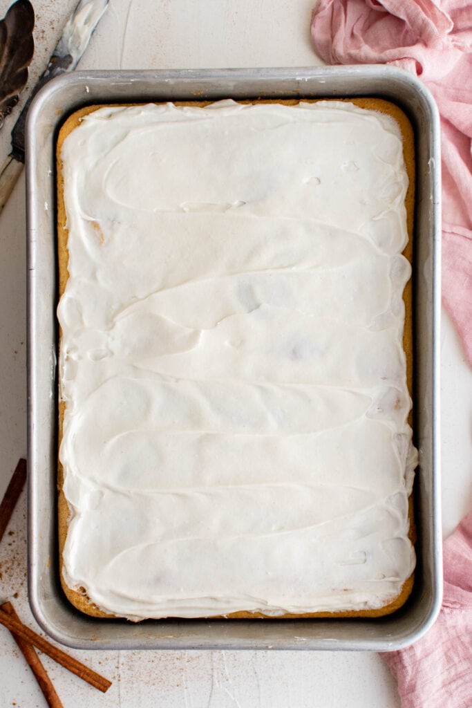 overhead photo of cake with white frosting