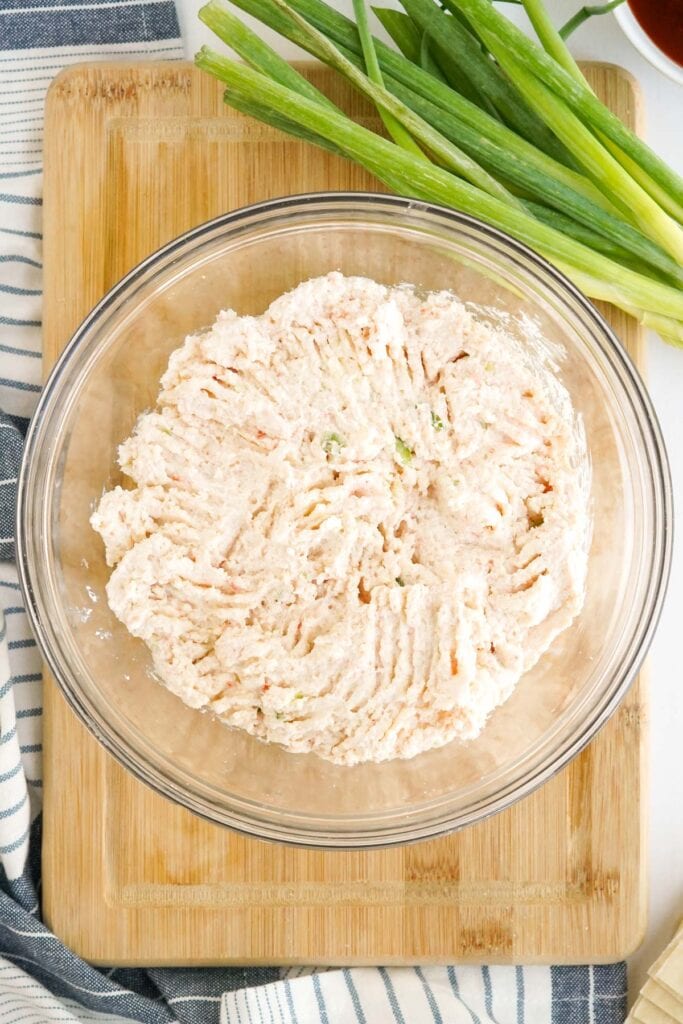 bowl of filling with crab and cream cheese, green onions