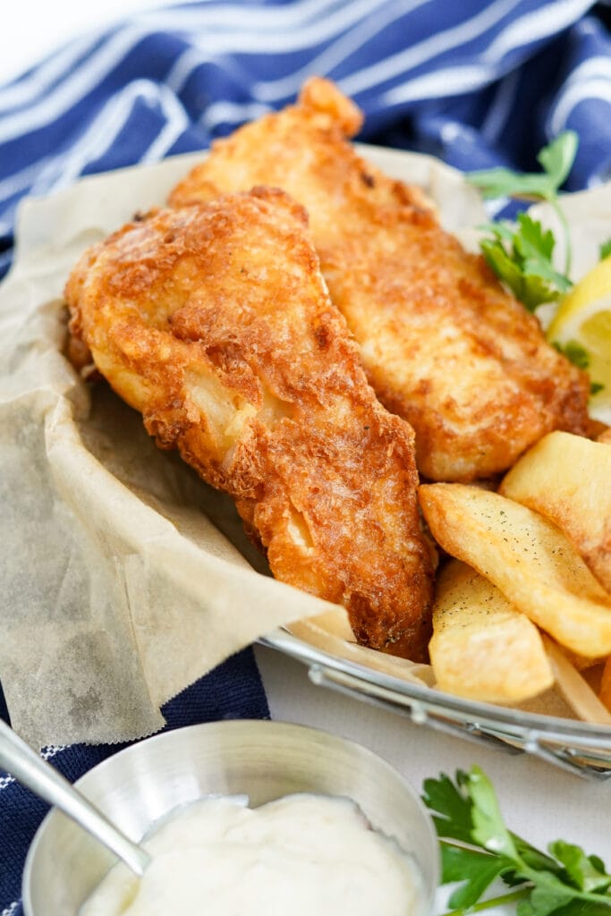 fish and chips in a wire basket