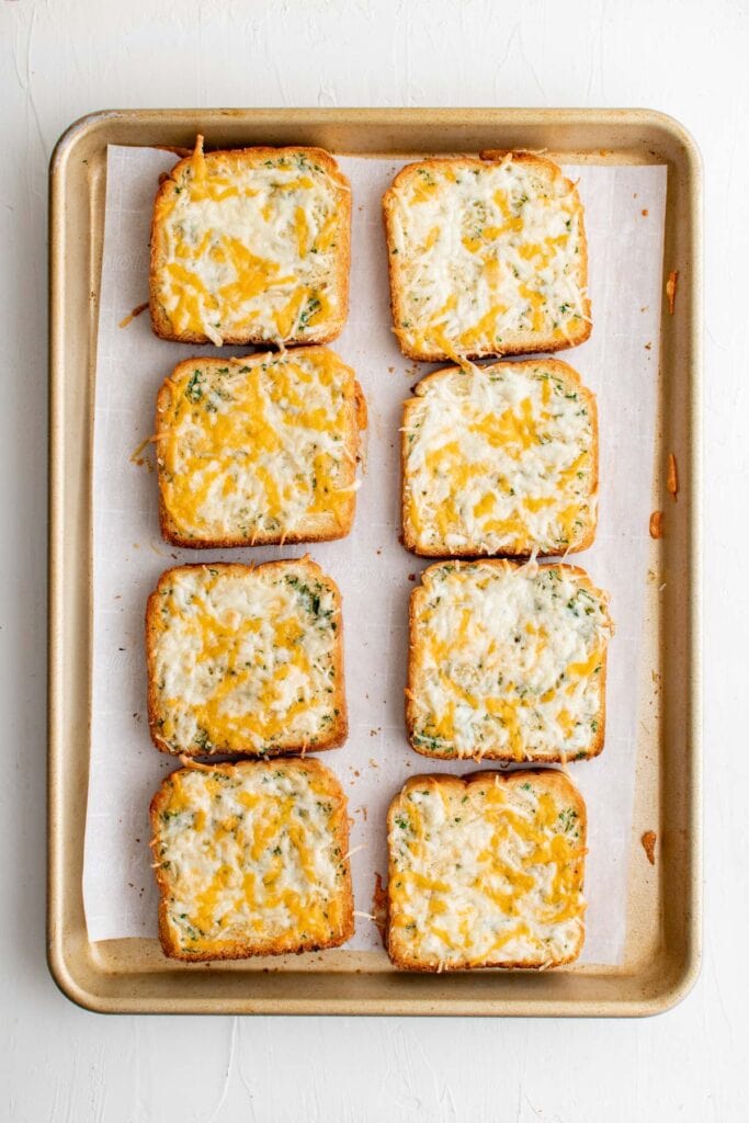 toasted garlic cheese toast on a baking sheet