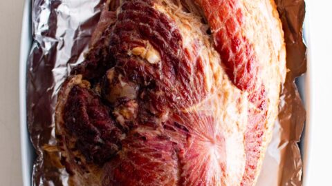 bone in ham in a foil lined baking dish