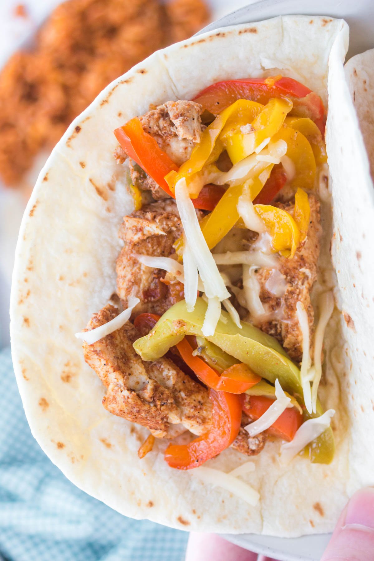 flour tortilla with chicken and bell peppers