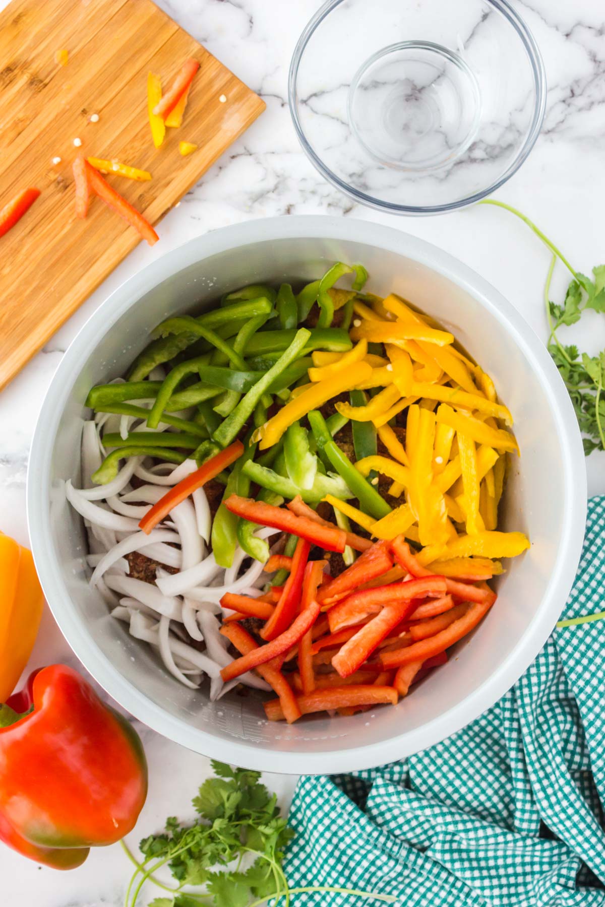 colorful bell peppers and onions in an instant pot