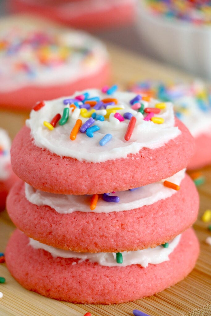 stack of pink cookies iwth frostn=ing