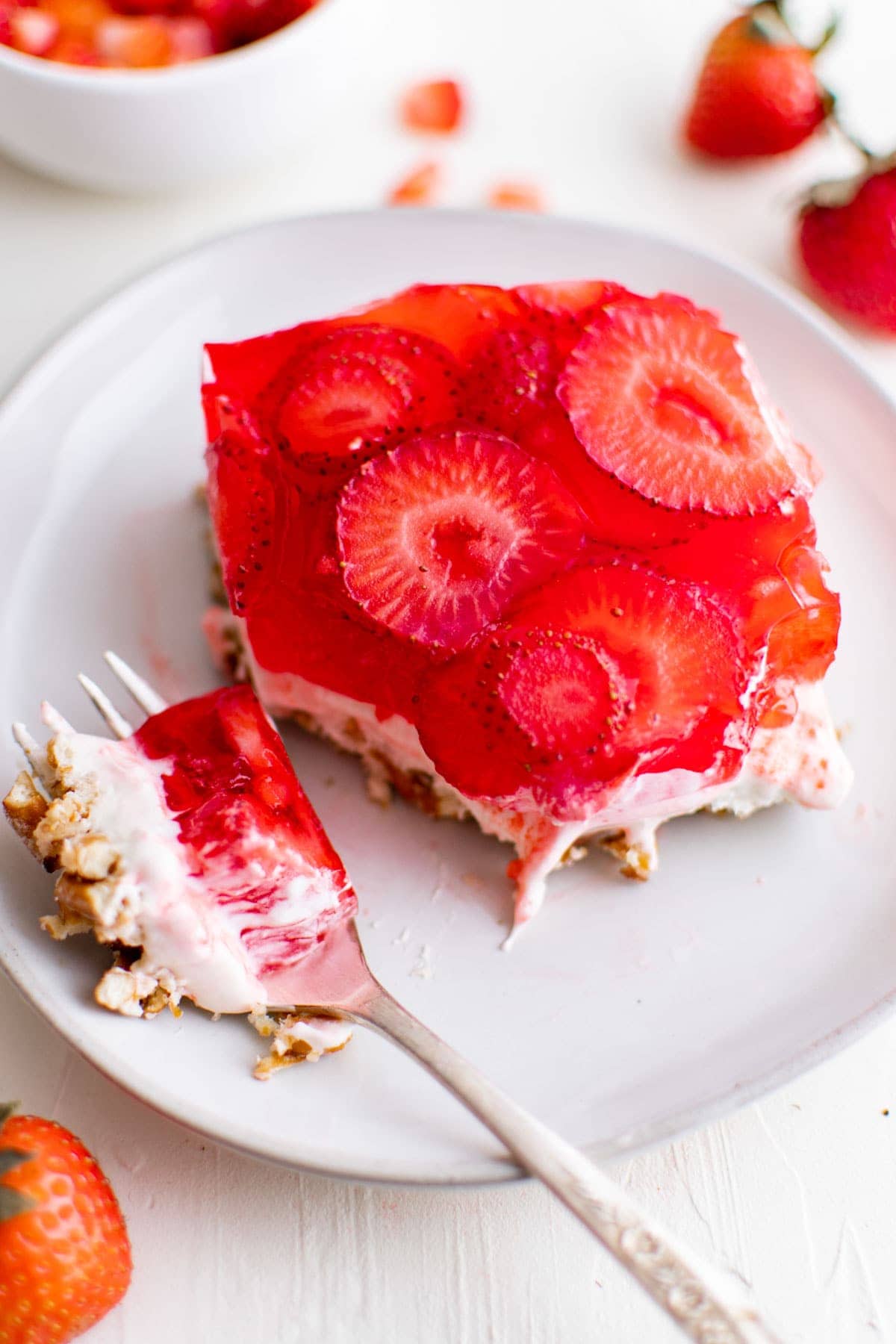 slice of strawberry pretzel salad, a fork