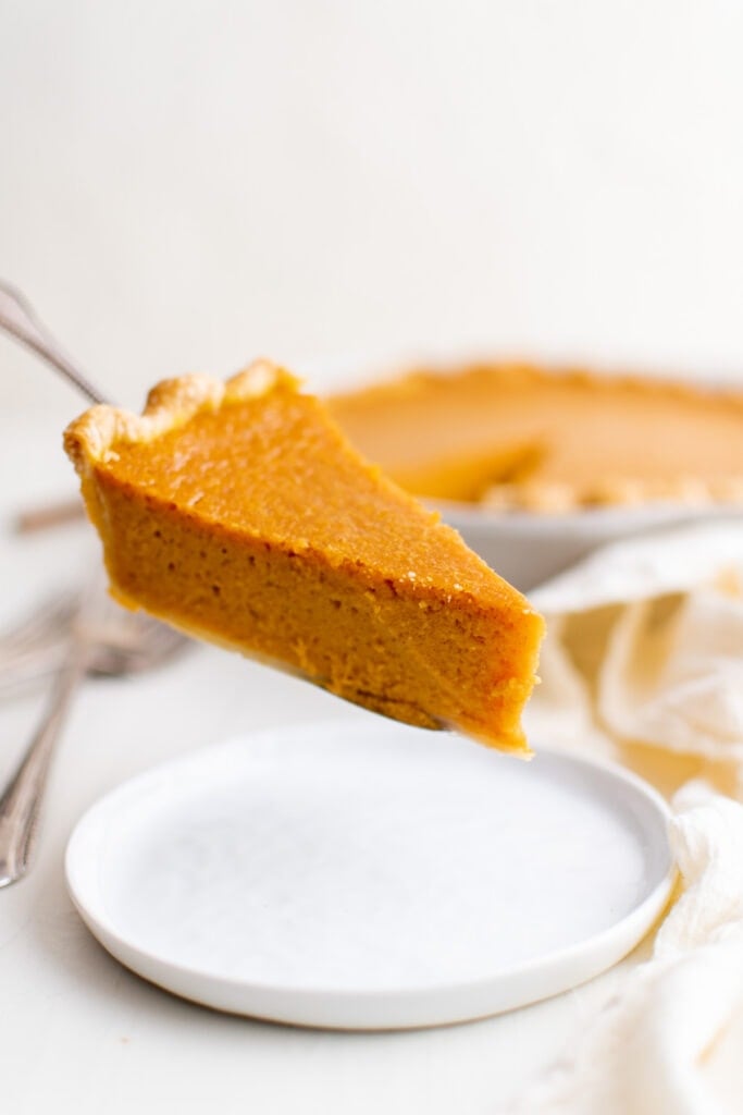 slice of sweet potato pie on a serving spoon