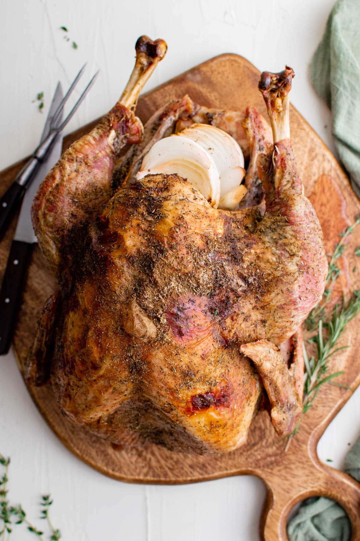 roasted turkey with crispy skin on a cutting board