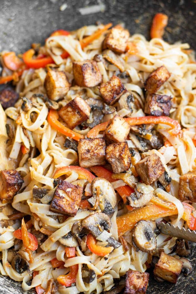 carrots, mushrooms and tofu in a skillet