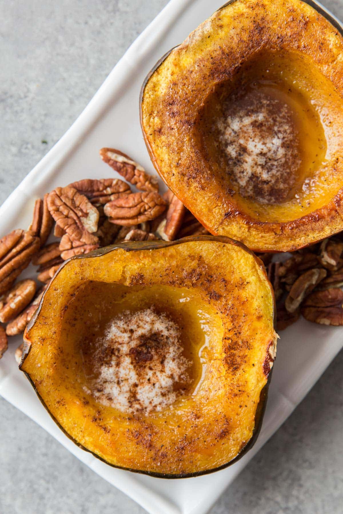 acorn squash halves, baked and filled with melted butter and spices