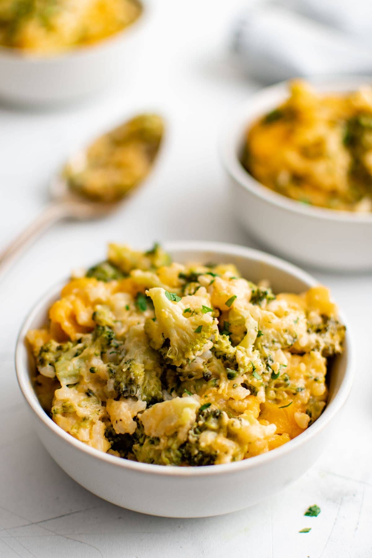 unbaked rice and broccoli casserole with shredded cheese